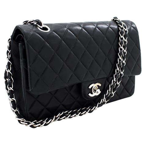 small black chanel bag with silver chain|Chanel black quilted flap bag.